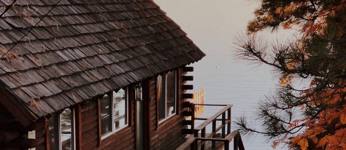 Representative photo: a wooded lakeside home