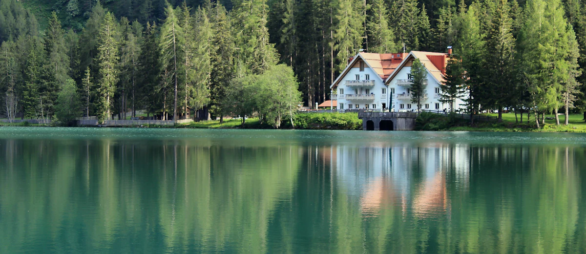 Representative photo: a wooded lakeside home