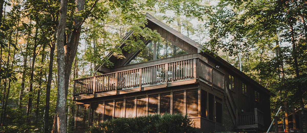 Representative photo: a wooded lakeside home