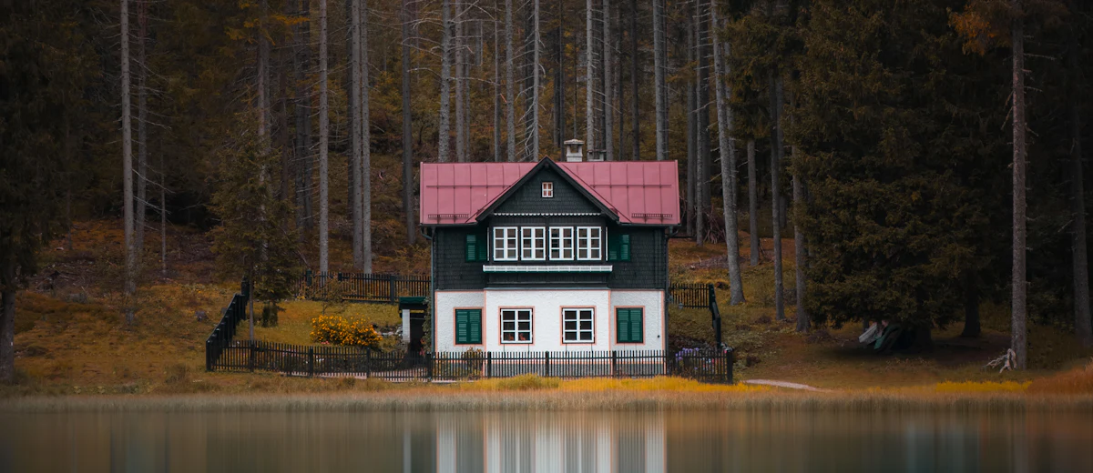 Representative photo: a wooded lakeside home