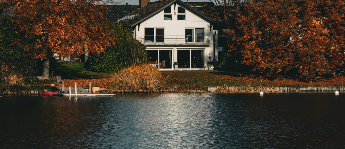 Representative photo: a wooded lakeside home